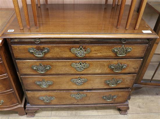 A George III mahogany chest, of four long drawers with brushing slide, W.86cm
